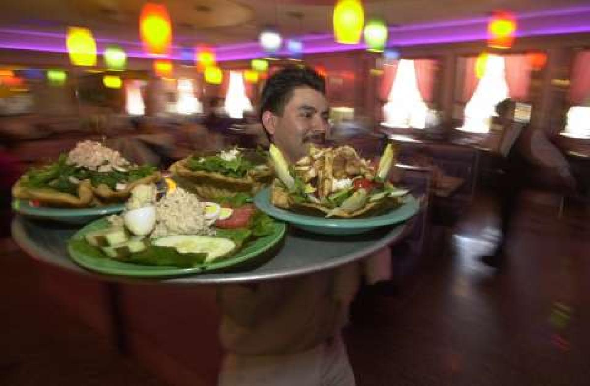 A waiter at a Bronx restaurant. . (KEITH D. BEDFORD/NEW YORK DAILY NEWS)