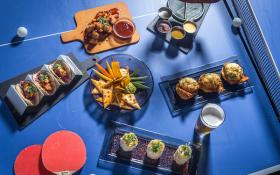 Kick back, drink up, chow down, or dance — it’s all fun and games at Slate NY. Photo by Paul Wagtouicz.